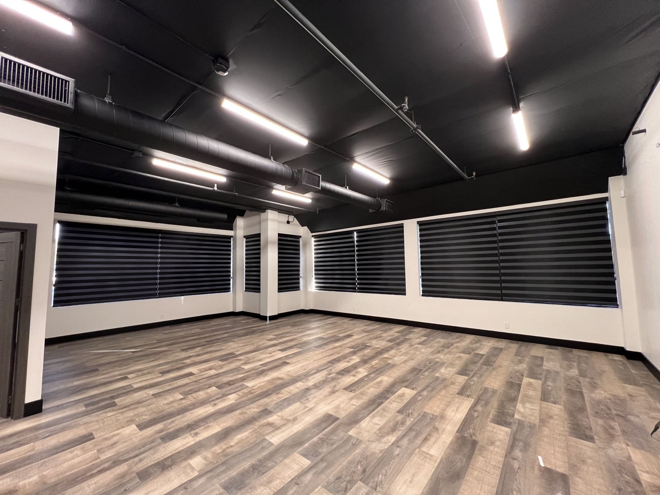 Open-plan office with blackout zebra bands fully closed
