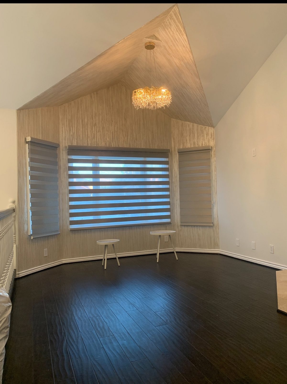 Real ShadeSpot install: light-filtering zebra shades on three windows in a vaulted living room