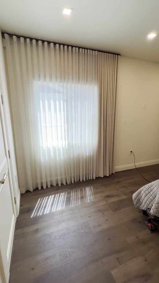 Real ShadeSpot install: sheer ripple-fold drapery drawn across a wide window
