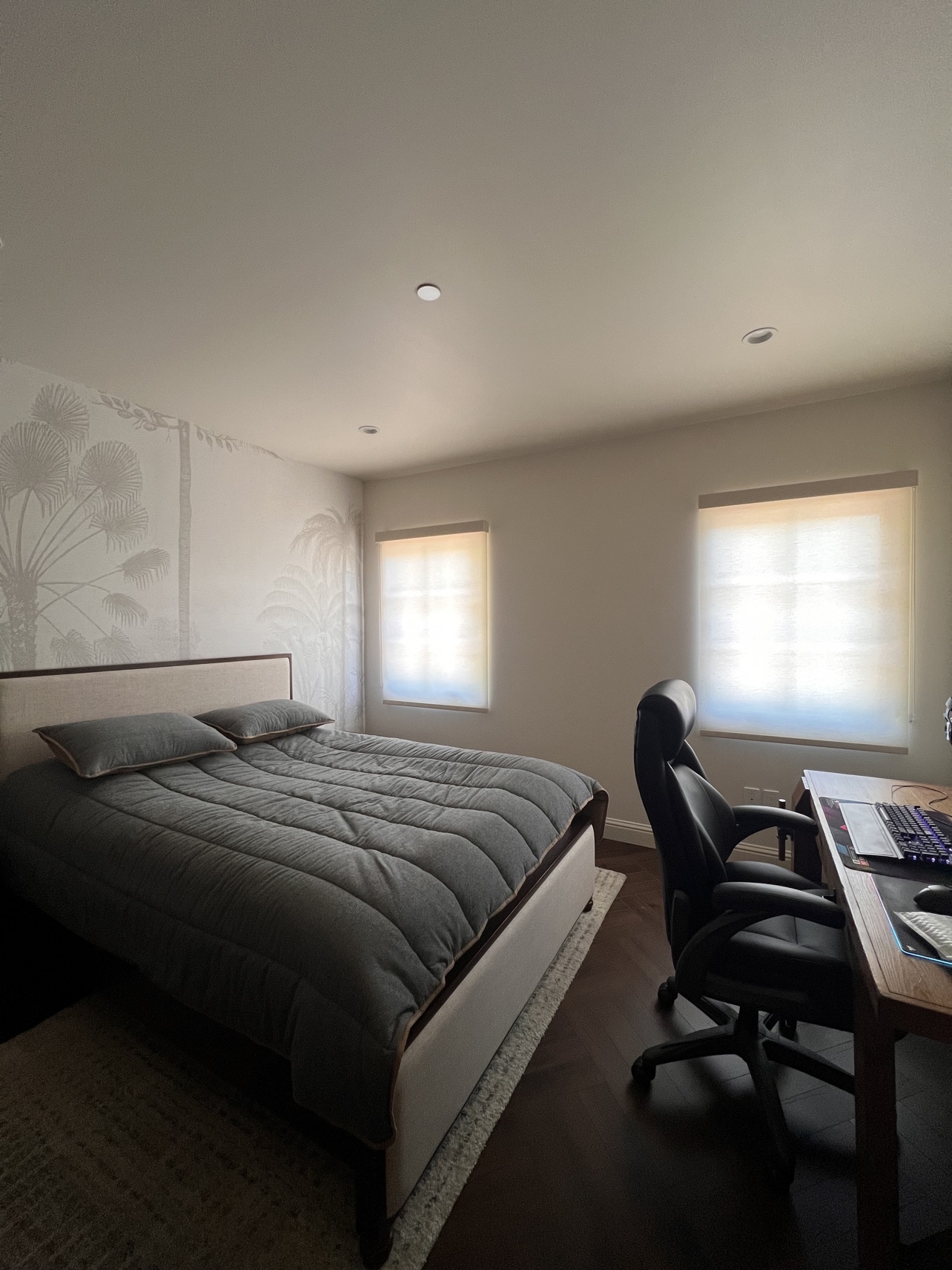 Real ShadeSpot install: white light-filtering roller shades on two windows in a bedroom