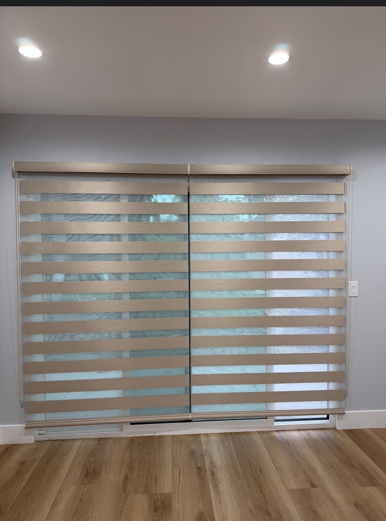 Real ShadeSpot install: zebra shades over a sliding glass door in a customer’s home