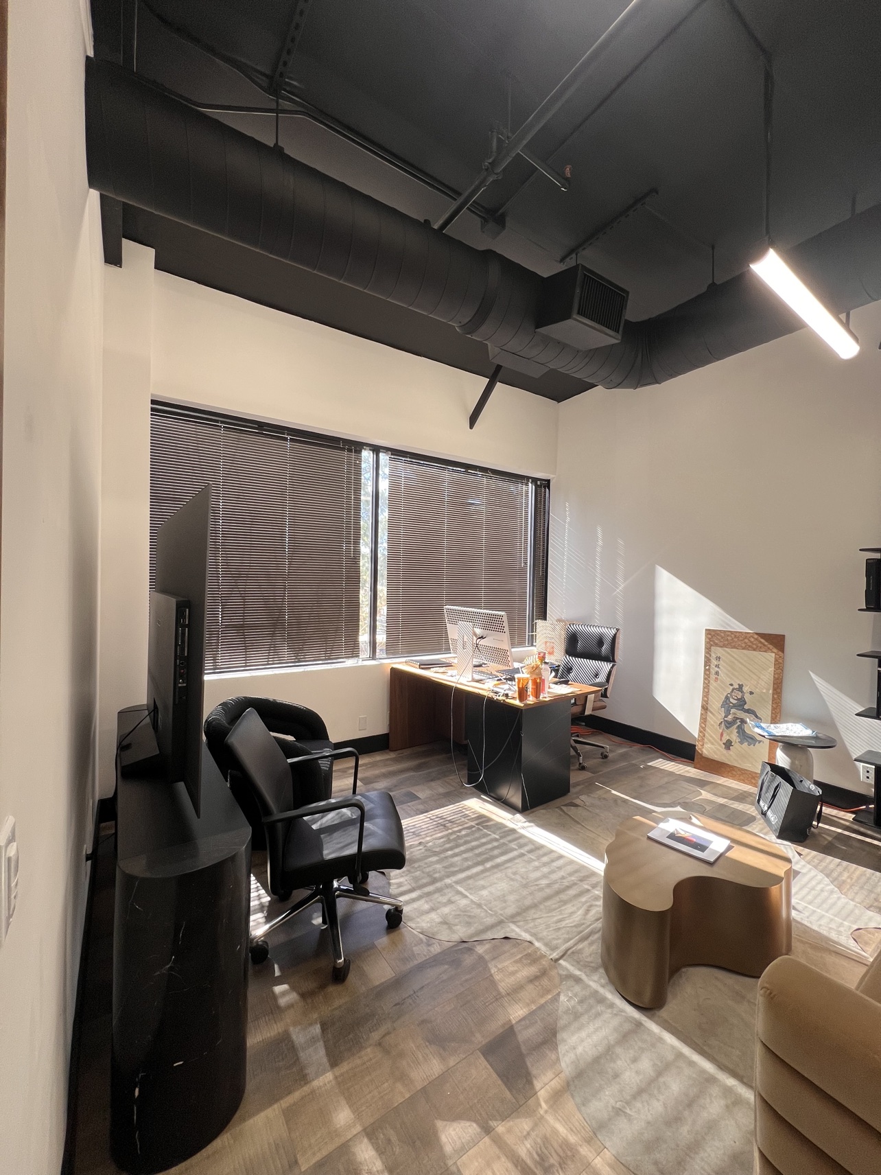 Before: the same private office with dated brown blinds